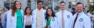 Six 全球网络赌博平台 medical school students pose in their white coats